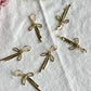 Gold Ribbon Bow Huggie Earrings