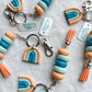 Tangerine, Sky Blue, and Turquoise Rainbow Keychain