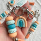 Tangerine, Sky Blue, and Turquoise Rainbow Keychain